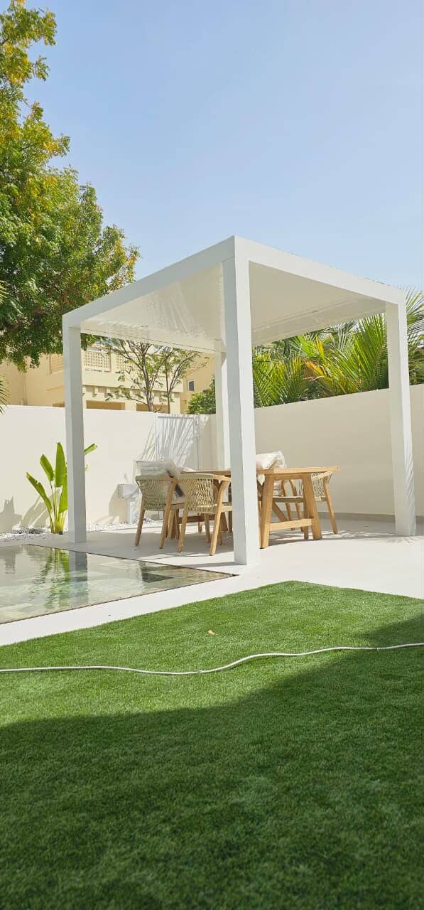 White aluminium louvre pergola with motorised roof installed at Dubai villa by Diamond Step UAE